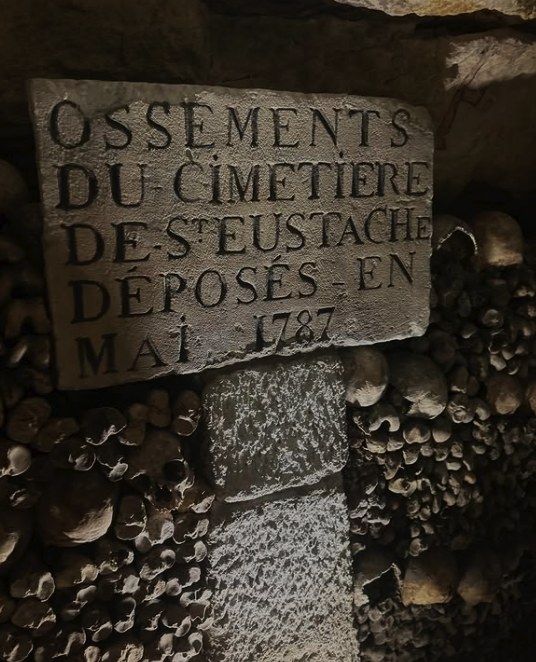 Carved stone plaque recording bones from the Saint-Eustache cemetery deposited in May 1787
